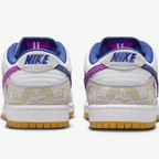 Nike SB Dunk Low Rayssa Leal - Vue latérale de la sneaker blanche avec empiècements beige et swoosh bleu royal, semelle gomme jaune