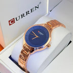 Montre Curren blanche cadran bleu – bracelet or rose