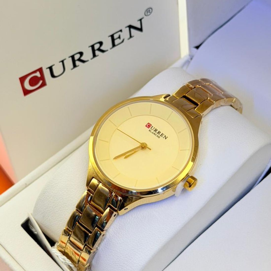 Montre Curren blanche or cadran champagne