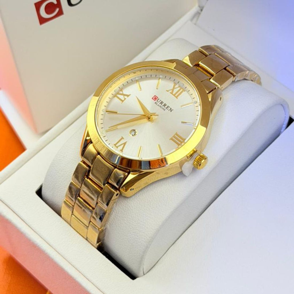 Montre Curren blanche or champagne  chiffres romains et date